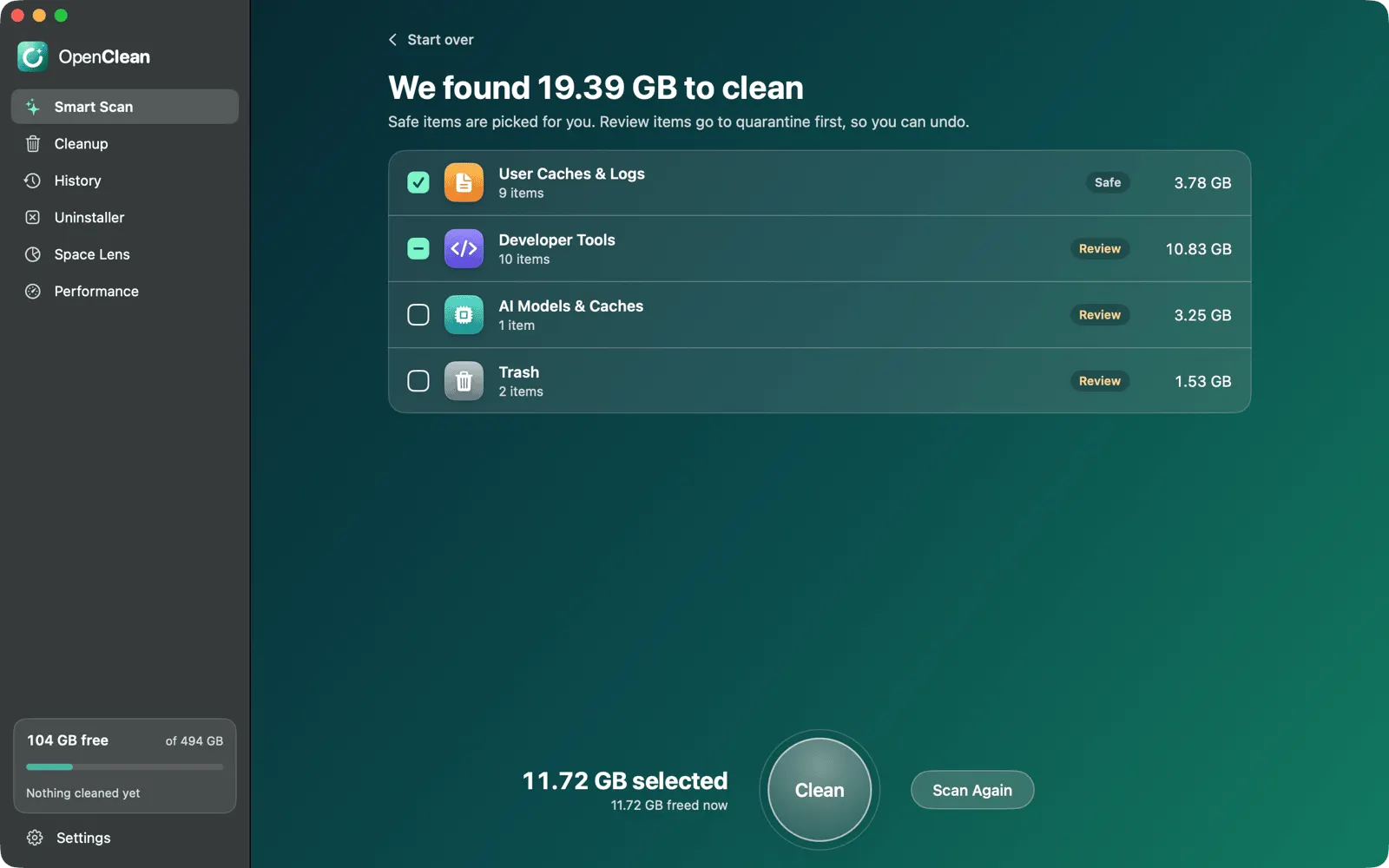 OpenClean's Smart Scan results: user caches and logs marked Safe, developer tools, AI models and Trash marked Review, with sizes and a round Clean button.